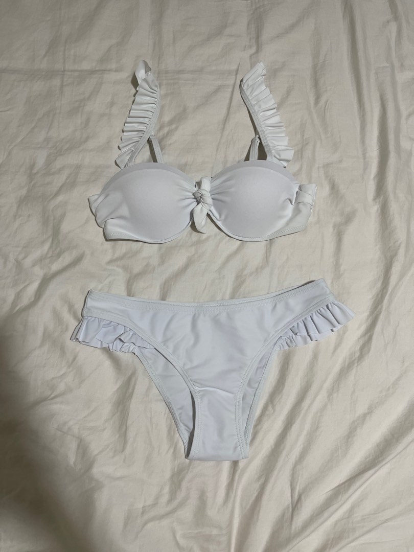 White swimsuit with ruffled metal buckle