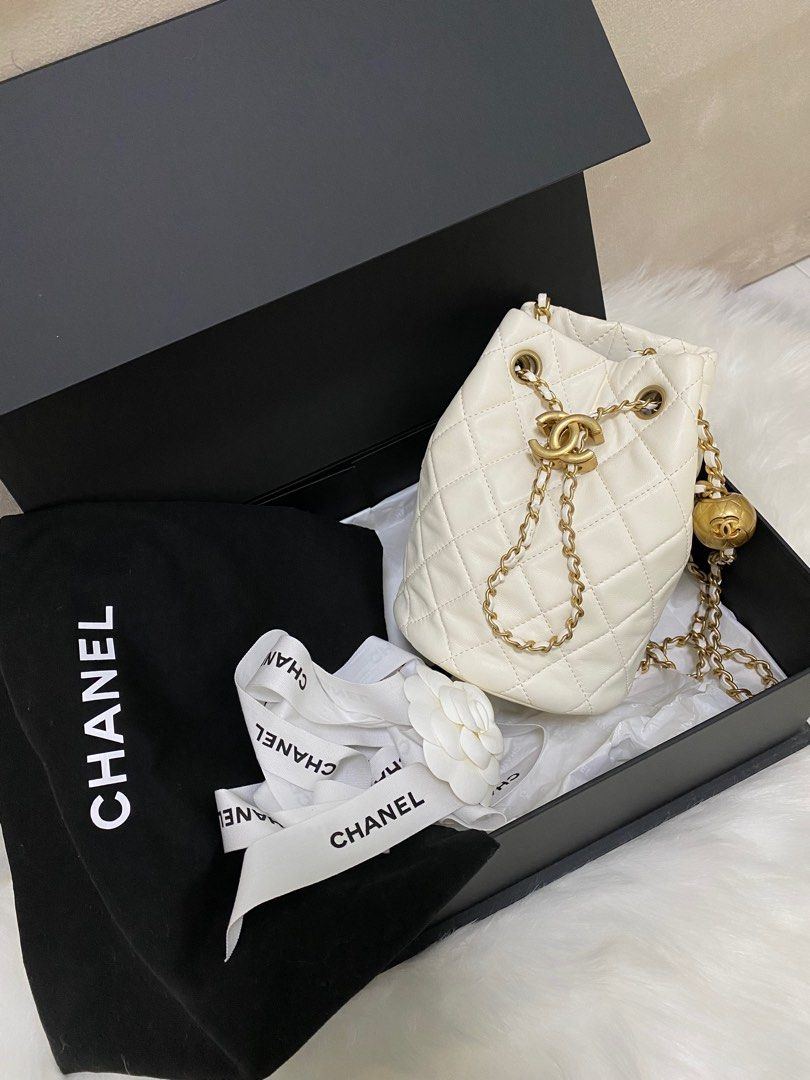 💯% Authentic Chanel Black & Beige Aged Calfskin Drawstring Bucket Bag,  Luxury, Bags & Wallets on Carousell