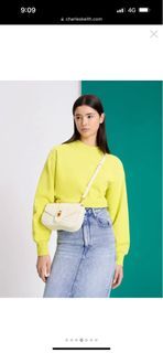 Charles & Keith TEXTURED HALF MOON CROSSBODY BAG ($59) ❤ liked on