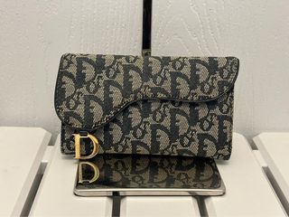 Dior vertical saddle pouch, Luxury, Bags & Wallets on Carousell