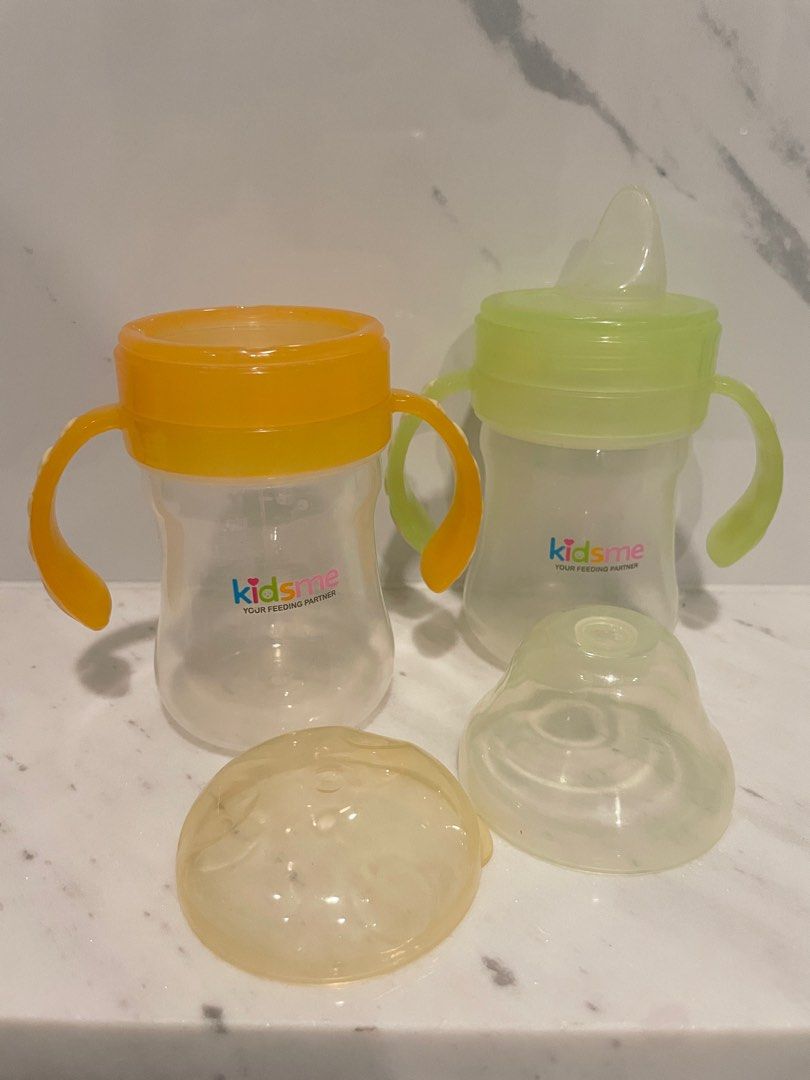 KidsMe set of 2 cups (Category: Weaning & Toddler Feeding) located in Quezon City. Submitted by thelazyloft (Listing ID 1259899571, Image 2). Description: KidsMe set of 2 cups - KidsMe Spoutless Training Cup 180ml - KidsMe Soft Spout Cup 180ml With built-in grips With hygiene caps BPA-free.