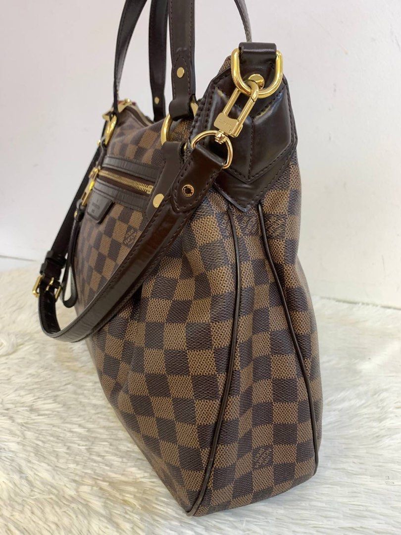 Evora leather handbag Louis Vuitton Brown in Leather - 29722841