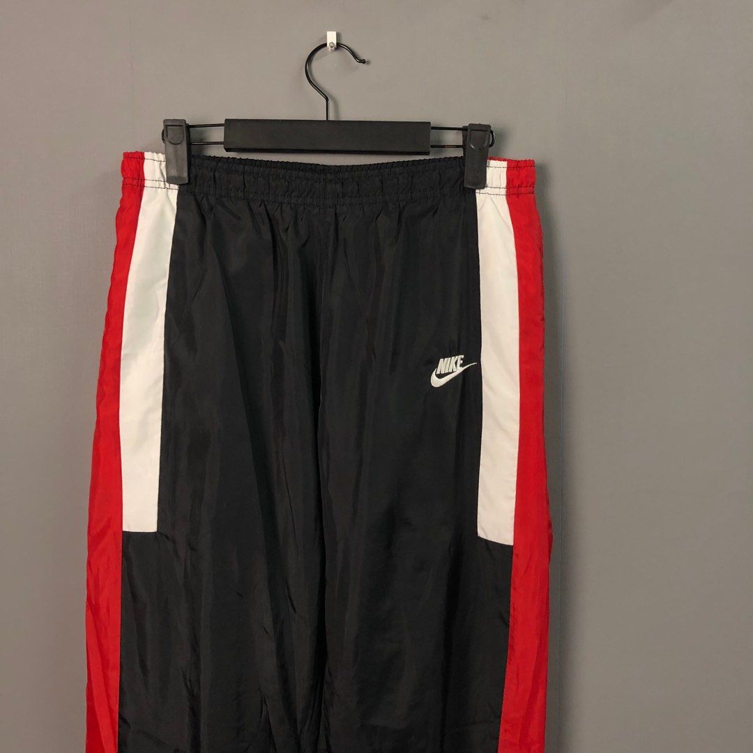 Nike reissue hotsell woven track pants