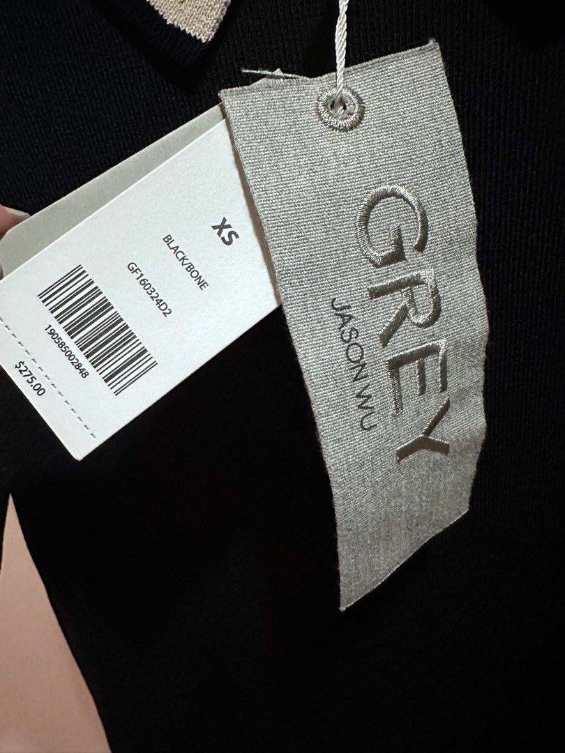 XS - S Jason Wu Brand: Grey (Category: Others Tops) located in Makati City. Submitted by corplady (Listing ID 1260044769, Image 2). Description: original price: 15k Classy / Formal / Black Knit / Semi-formal / Office Top / Polo Shirt.