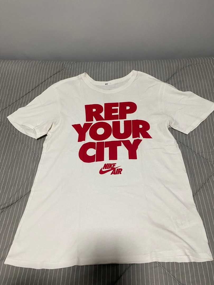 tan and white nike shirt