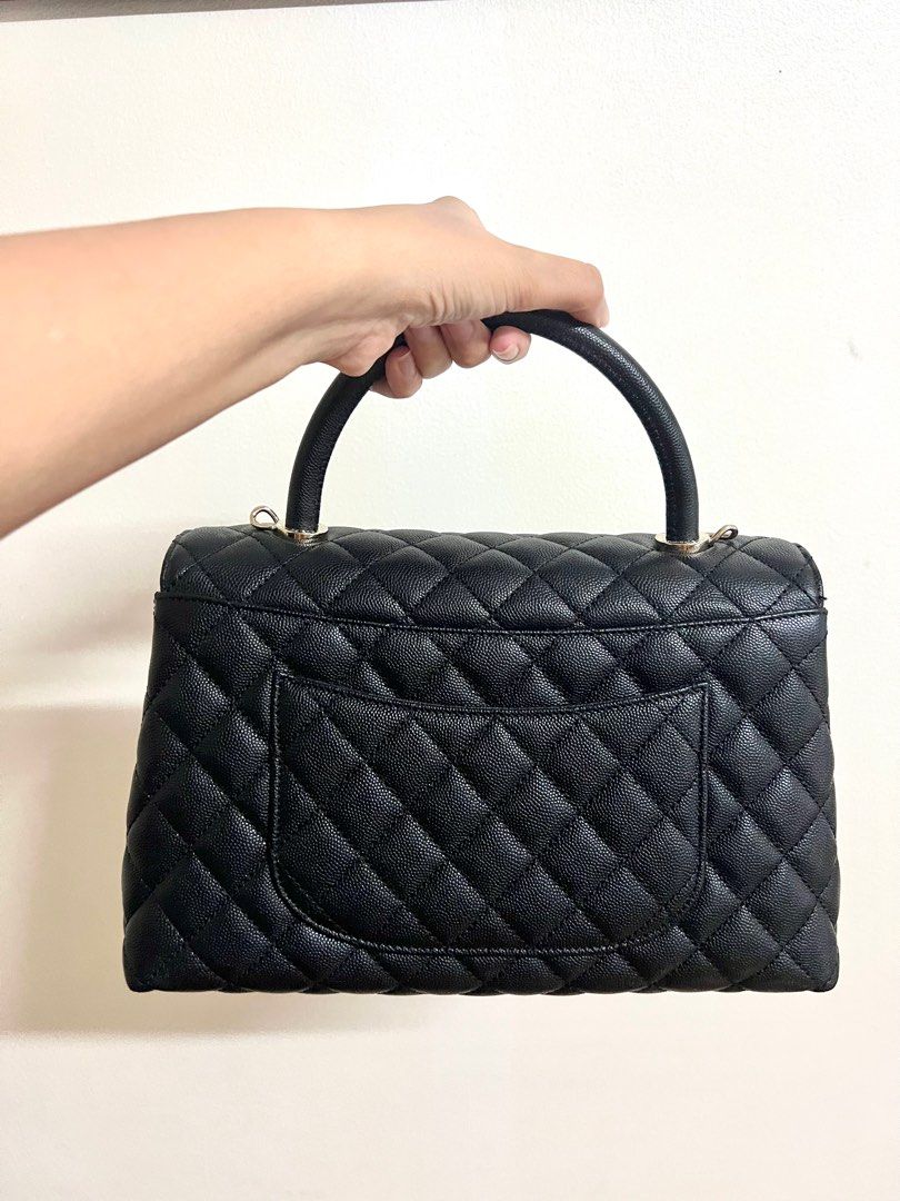 Chanel coco handle in black with champagne hardware (Category: Luxury Bags & Wallets) located in Makati City. Submitted by samfaves (Listing ID 1260427593, Image 2). Description: Pre loved Chanel coco handle in medium microchipped Bought end of last year Like new Completes with box , dustbag, receipt, paper bag. .