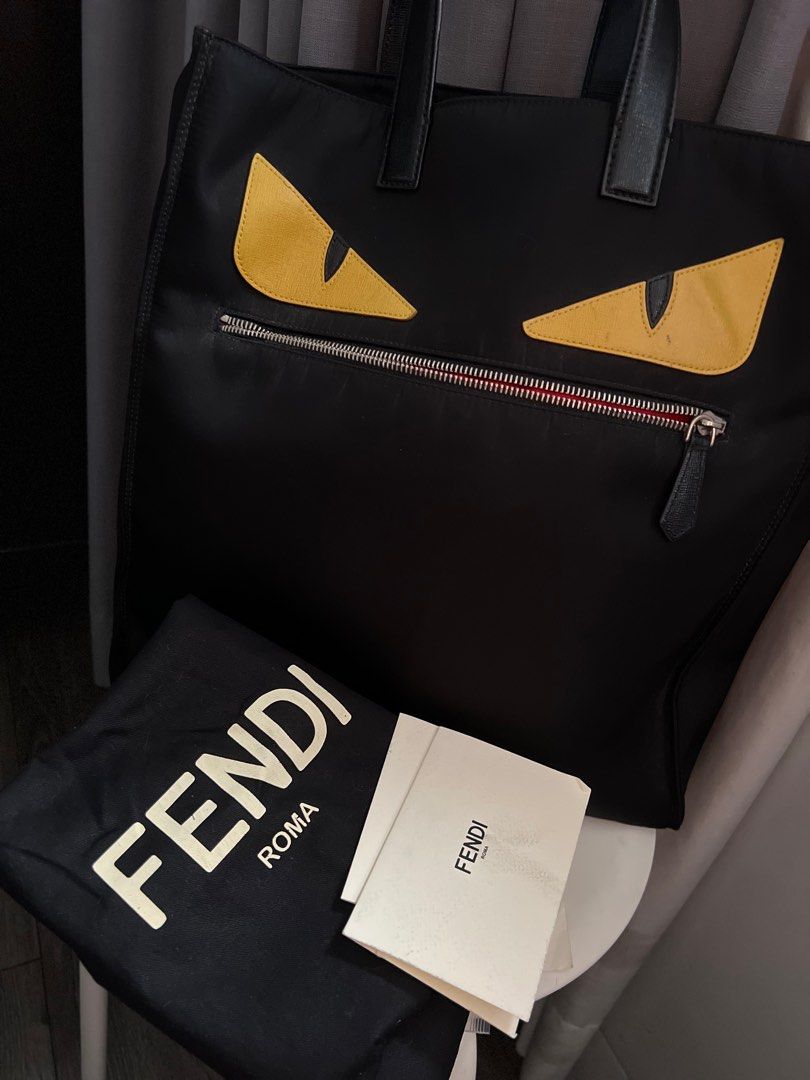 Fendi Monster Shopping Tote (Category: Luxury Bags & Wallets) located in San Juan City. Submitted by thefigtree88 (Listing ID 1260330375, Image 1). Description: Fendi monster shopping tote in black Made of nylon with leather strap Bought in Hongkong Comes with dust bag, care cards and receipt Minor wear shown on the strap and on the left eye (yellow eye tiny color fade) Meet up in Ortigas or greenhills area only .