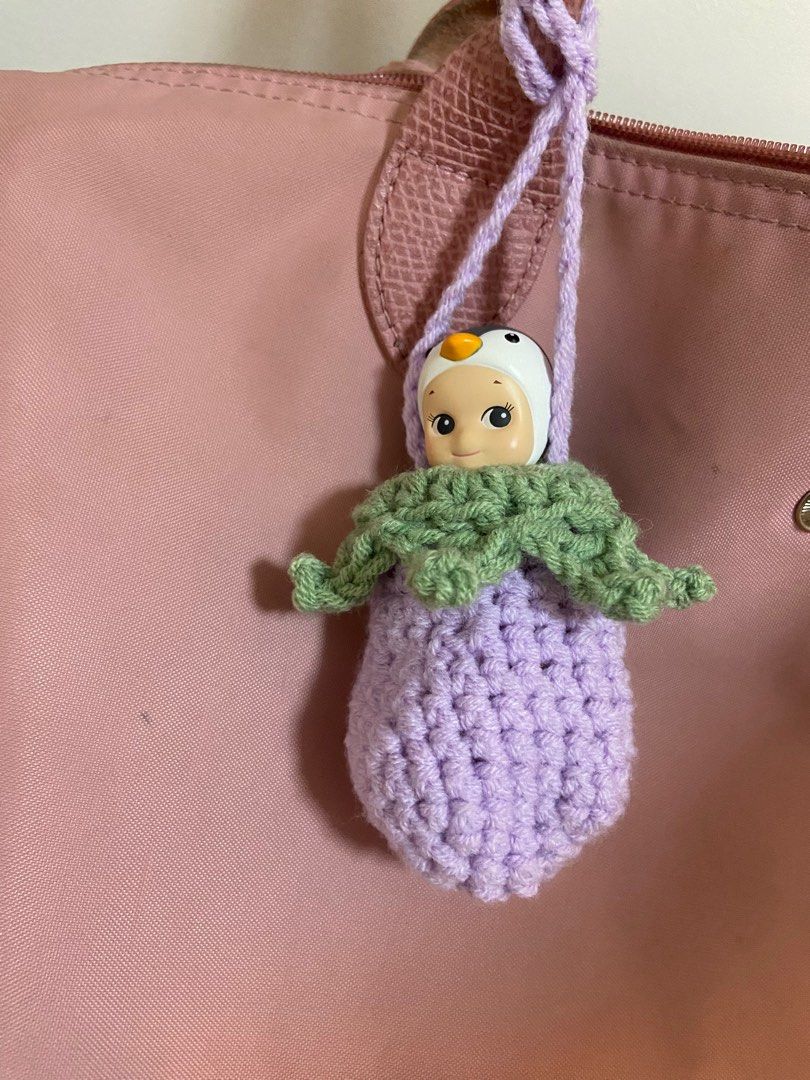 Sonny Angel Eggplant Pouch Bag Charm (Category: Designer & Blind Box Toys) located in Manila. Submitted by polly.studios (Listing ID 1260458479, Image 1). Description: check bio for SHOPEE LINK Guaranteed it won’t fall off your bag given the super secured stem around your sonny angel’s neck ;)) Tried and tested💕 .