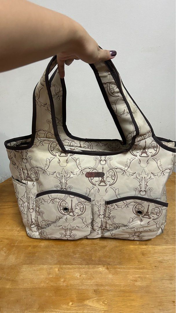 Baby Couture shoulder bag (Category: Shoulder Bags) located in Makati City. Submitted by acebunni (Listing ID 1260559419, Image 2). Description: PLEASE READ DESCRIPTION AND CHECK ALL PHOTOS FIRST ————— Baby Couture diaper bag / shoulder bag ₱800 + sf - well used - slight flaws on base from usage (see photo) - zippers are okay - very spacious bag for variety of purpose and usage (17” inch laptop for reference, laptop nor for sale), with zippers an