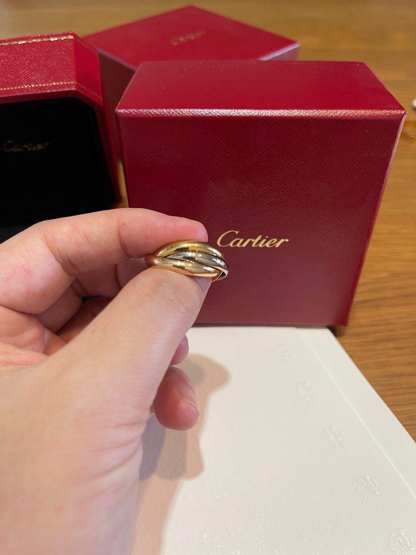 Cartier trinity discount ring on hand