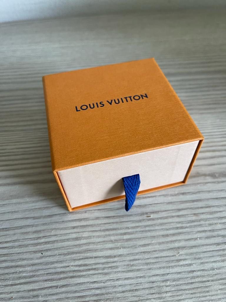 Louis Vuitton labeled ID Bracelet in original pouch and box