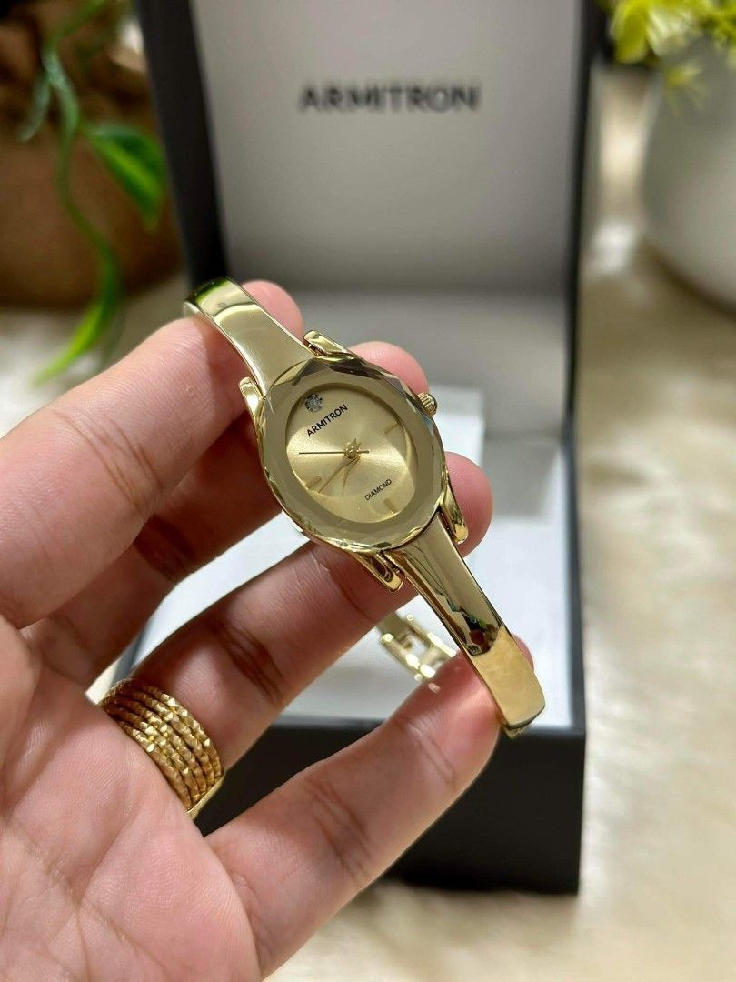 Armitron gold diamond watch top