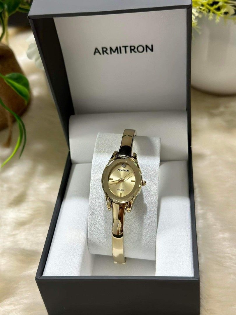 Armitron Women s Gold Tone Diamond Dial Bangle Dress Watch