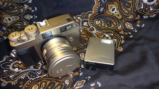 Contax G1 film camera with Carl Zeiss Planar f2 / 45mm lens with Contax Flash TLA140 combo