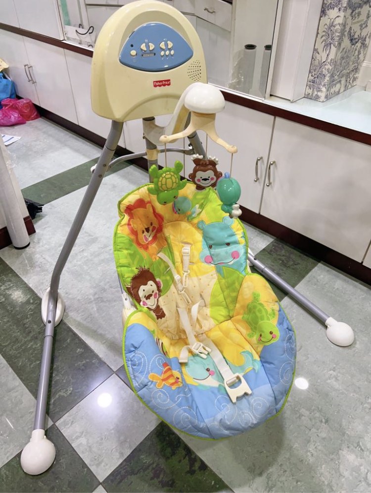 Fisher price animals of the world cradle online swing