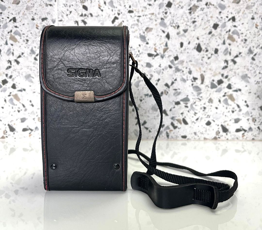 Vintage Sigma NC-50 leather lens case (Category: Camera Bags & Carriers) located in Quezon City. Submitted by sustainable.sarah (Listing ID 1260717953, Image 1). Description: 6.5" height x 3.25" width x 3" length With Removable/Adjustable Straps Black Leather, Snap Closure, Padded Interior. The silver parts are already rusty - this is the only flaw. Great Condition 9/10 Made and bought in Japan back in the 90's. This was my uncle's .