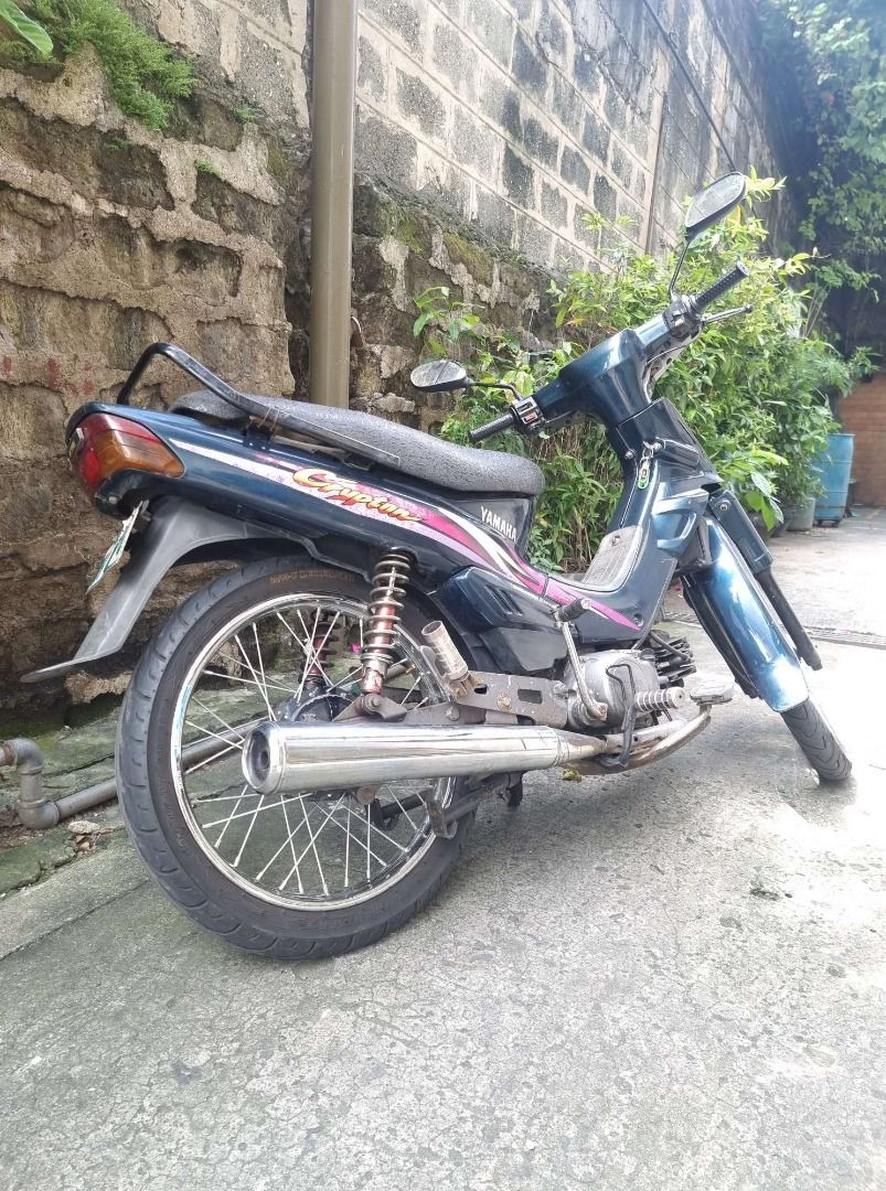 Yamaha Crypton - BLUISH BLACK 2003 Model (Category: Motorbikes for Sale) located in Quezon City. Submitted by kontaktpoint (Listing ID 1260714198, Image 2). Description: Yamaha Crypton - BLUISH BLACK 2003 Model Engine Displacement : 125cc , Complete and Registered LTO Documents, Seldom used, KM Reading:19,760 KM. , Transmission; Semi Automatic ₱15,000.00 or Best Offer. Contact Person: Emily Contact Number: 09772591198.