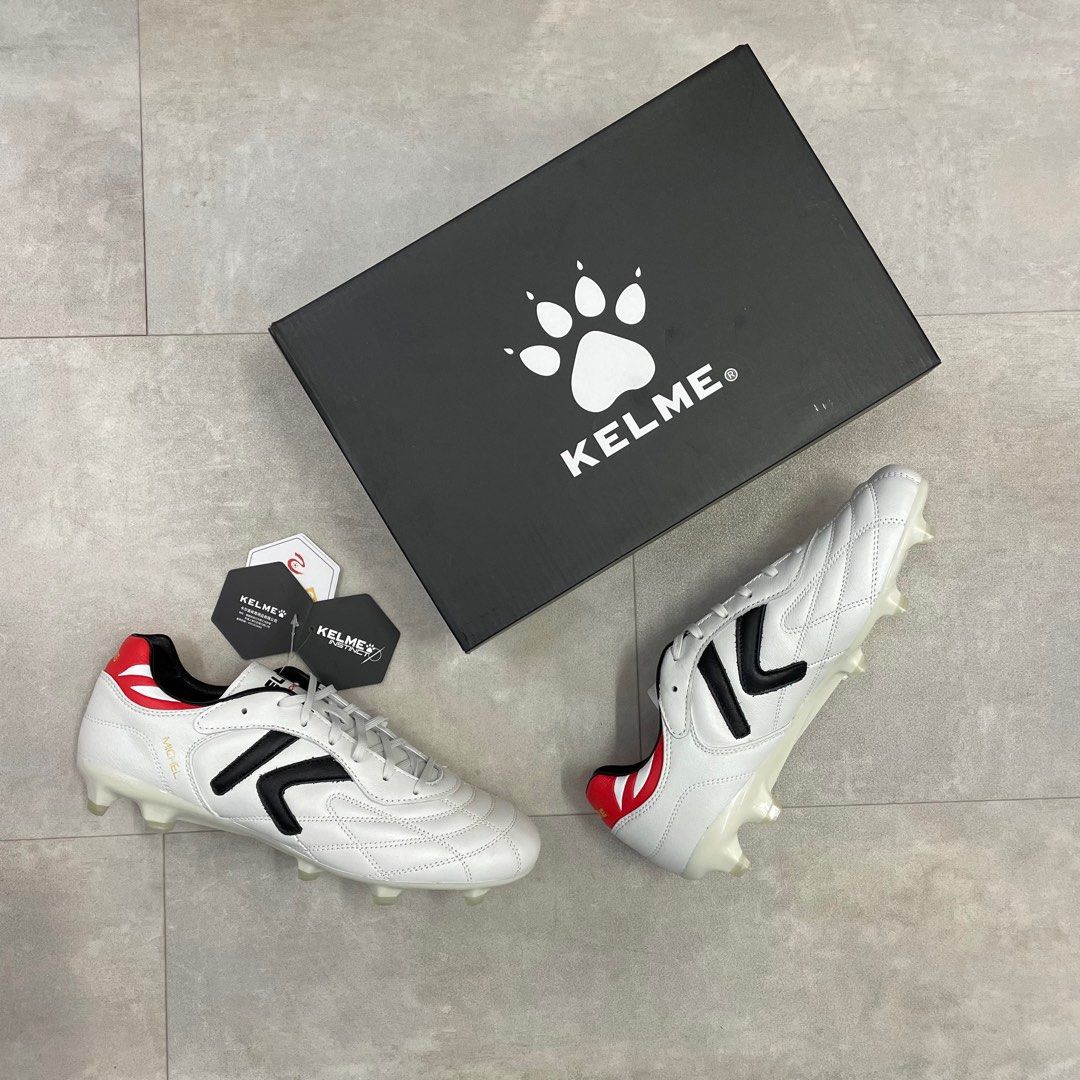 Grey and red football boots on sale