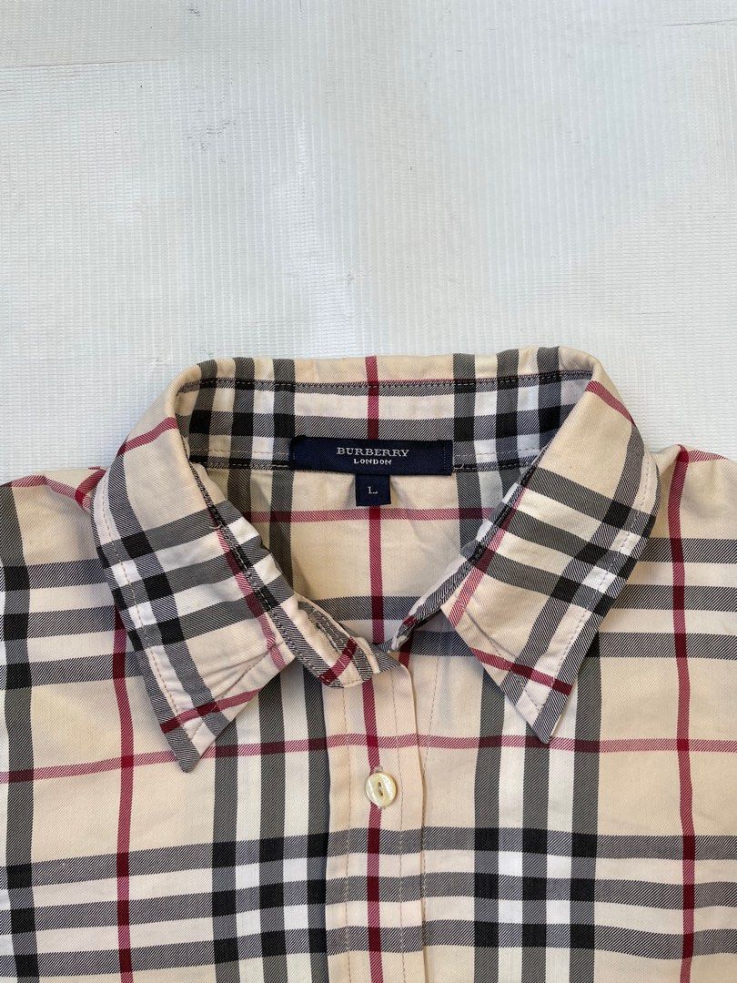 Burberry nova plaid Longsleeve (womens) (Category: Longsleeves) located in Quezon City. Submitted by Prive_Online (Listing ID 1260934720, Image 3). Description: WTS! - Burberry nova plaid Longsleeve (womens) Authentic/Legit Size: Large on tag but fits small Dimensions: L 23 x W W 20 Excellent condition Minor issue: Lost 1 button (Collar area) - 1650 Shipped Firm! No LP‼️ - Loc: Q.c Dm .