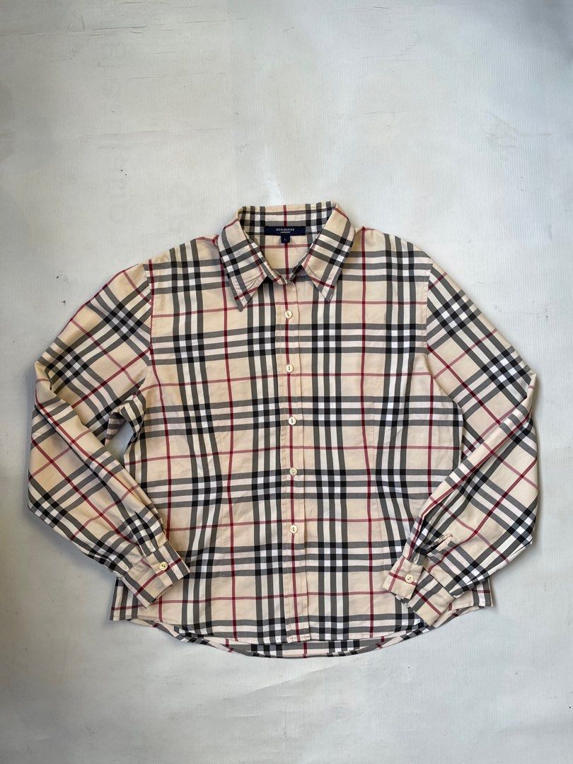 Burberry nova plaid Longsleeve (womens) (Category: Longsleeves) located in Quezon City. Submitted by Prive_Online (Listing ID 1260934720, Image 1). Description: WTS! - Burberry nova plaid Longsleeve (womens) Authentic/Legit Size: Large on tag but fits small Dimensions: L 23 x W W 20 Excellent condition Minor issue: Lost 1 button (Collar area) - 1650 Shipped Firm! No LP‼️ - Loc: Q.c Dm .