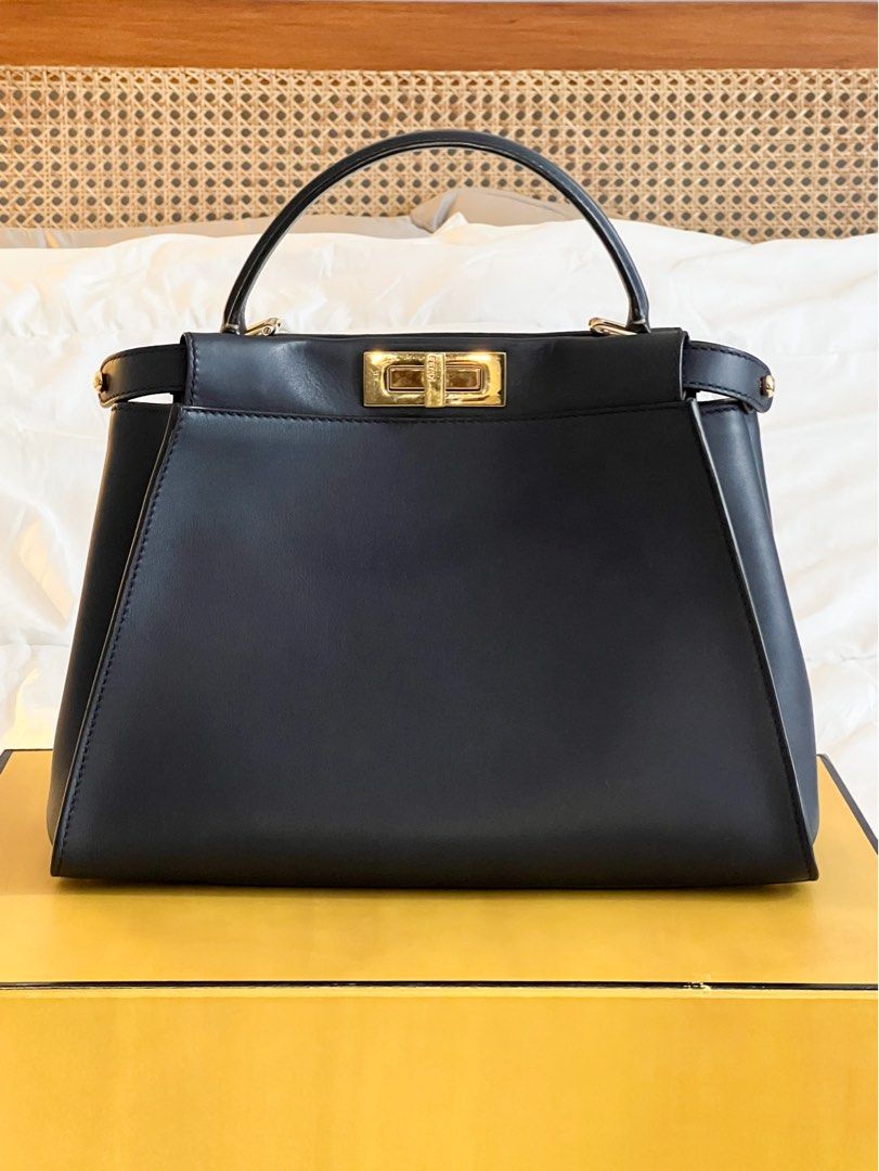 Fendi Iconic Medium Peekaboo Navy Blue GHW (Category: Luxury Bags & Wallets) located in Quezon City. Submitted by alexpreloveditems (Listing ID 1260177165, Image 1). Description: - Rarely used - Fendi website doesn’t have the Iconic in Medium anymore, just the ISeeU ($5800) - Last pics are reference of current Fendi Prices - Still in pristine condition - Very structured as seen on pics (no filler or bag organizer) - Comes with box, dustbag, card,