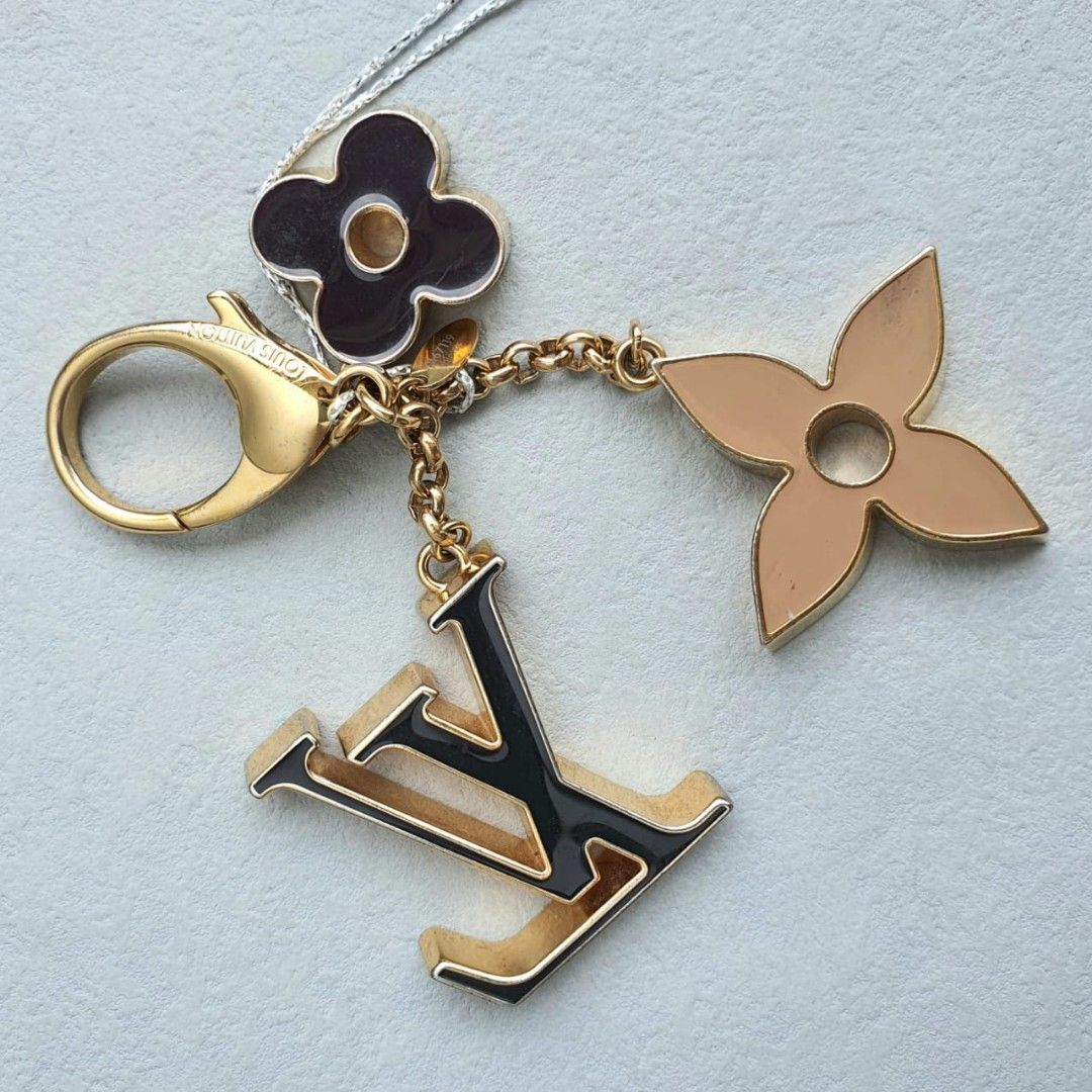 Lv bag charm sales