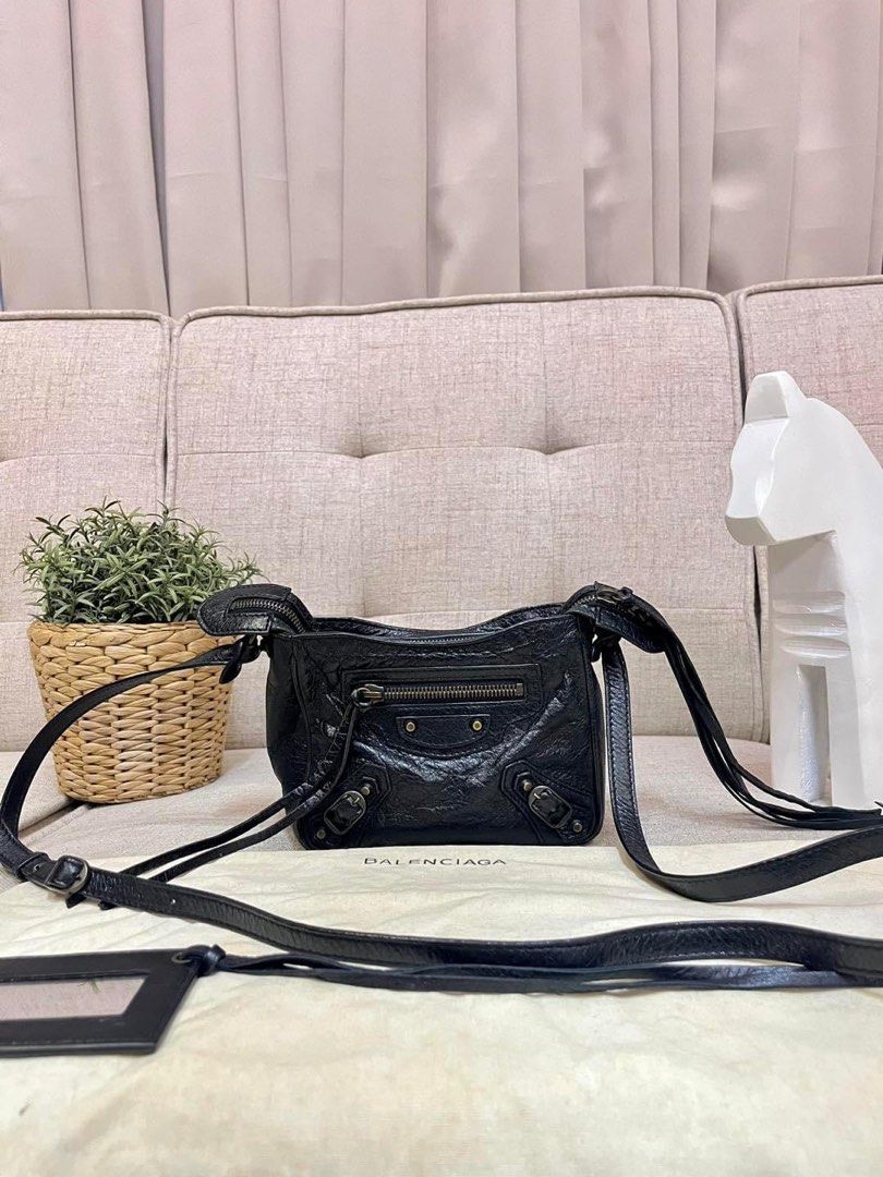 Balenciaga Mini Sling Bag Black (Category: Luxury Bags & Wallets) located in Manila. Submitted by bagislifeshop (Listing ID 1258015539, Image 1). Description: 100% Authentic Balenciaga Mini Sling Bag Black Condition: 9/10 Comes with Dustbag and Entrupy Cert .