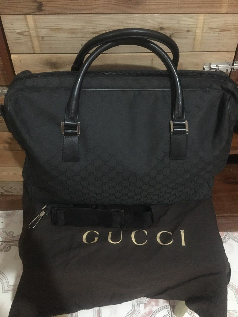 GUCCI travelling bag (Category: Luxury Bags & Wallets) located in Gapan. Submitted by sheilla09 (Listing ID 1257904858, Image 1). Description: with dustbag minimal scratches good as new searchable code.