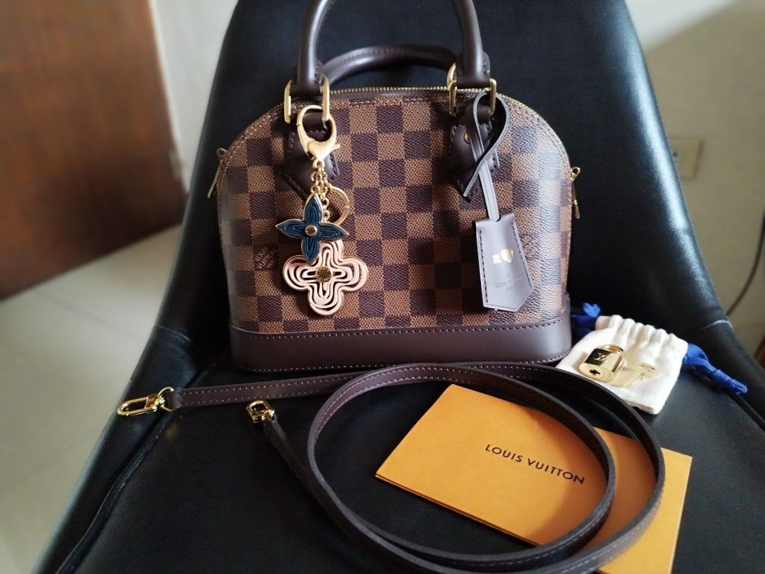 Louis Vuitton Alma BB Damier Ebene (Category: Luxury Bags & Wallets) located in Cainta. Submitted by cookie8186 (Listing ID 1258031507, Image 2). Description: Alma BB in Damier Ebene. With receipt. Malabo na po Yung receipt, but aninag naman Yung price and Yung bag. No more box and paper bag. With dustbag Very good condition, bihira lang nagamit. Hotstamped with my initial. Free ko na rin Yung original LV charm. Kindly see my listing for the LV c