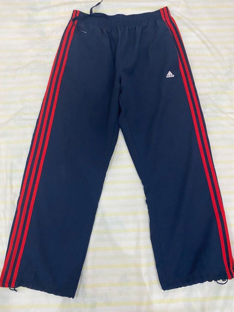 Adidas track pants blue with red stripes deals