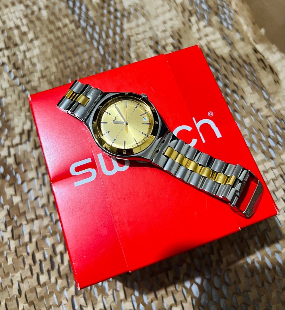 Swatch two outlet tone watch