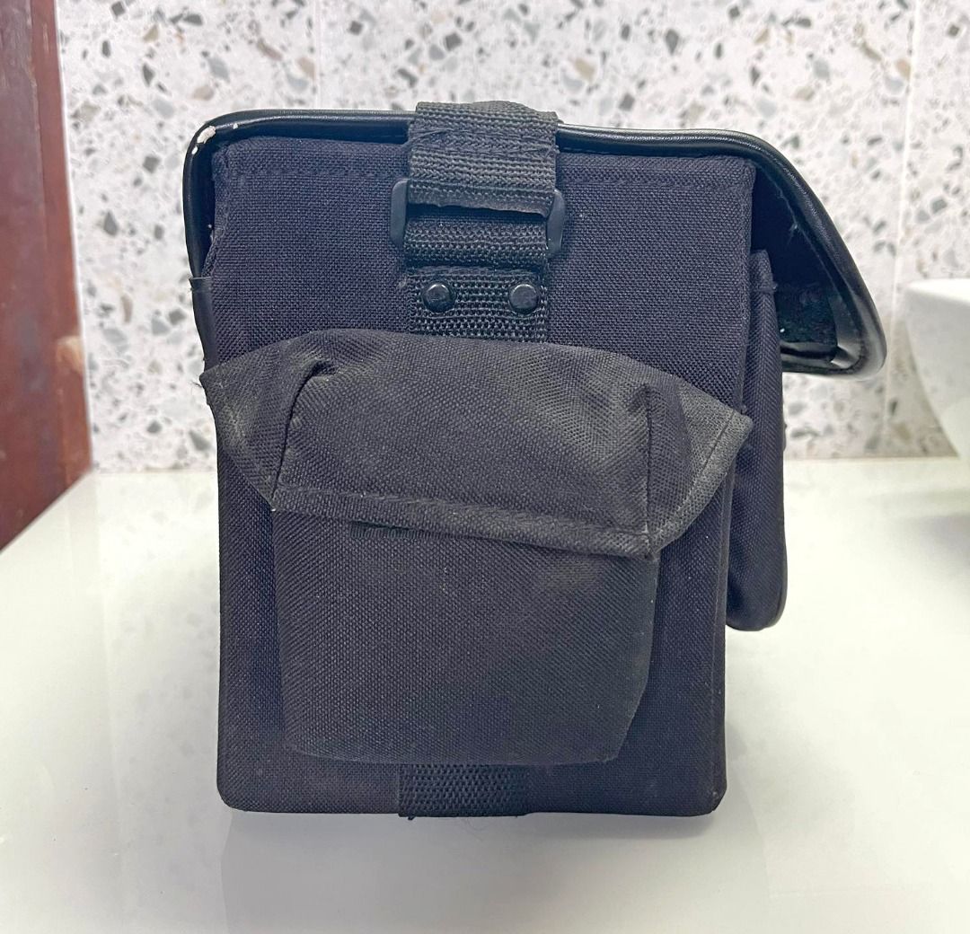 Vintage Sony camera bag (Category: Camera Bags & Carriers) located in Quezon City. Submitted by sustainable.sarah (Listing ID 1261049660, Image 2). Description: Vintage Sony camera bag 8" height x 7" width x 11" length Black color. Has 2 side pockets and 1 front pocket. Complete straps and locks Only flaw is that it's missing a foot, see 6th image. Might need a bit of cleaning as well, but nonetheless, still in mint condition..