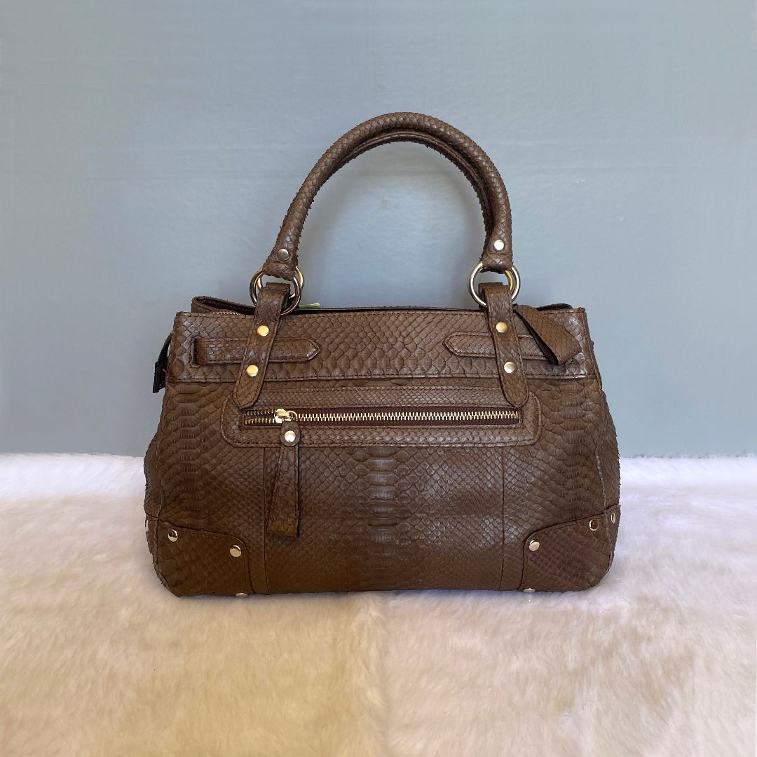 Wel Exotic Leather Japan Brown Python Leather Satchel Tote Bag (Category: Tote Bags) located in Cebu City. Submitted by posh_avenue888 (Listing ID 1261110490, Image 3). Description: Brand new with tags (Yen185,000). Crafted in genuine snakeskin/python leather. Made in Japan. 100% authentic or your money back!!! Measurements (taken flat - approximate): Length: 13.5 inches; Height: 9 inches; Depth: 5.5 inches; Handle drop: 6.5 inches..
