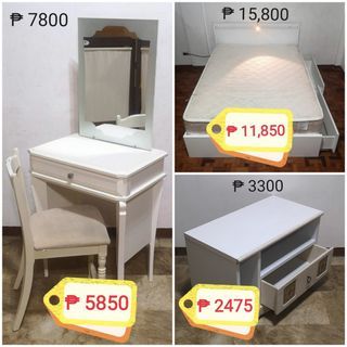 White furniture: double bed, vanity mirror, side table