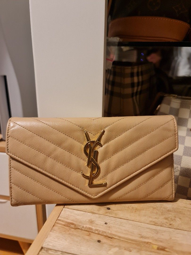 Authentic YSL wallet (Category: Luxury Bags & Wallets) located in Las Pinas. Submitted by juliagarcia95 (Listing ID 1261308311, Image 1). Description: no issue except it was recolored by Primerestoreph authentic money back guarantee you can check the item first cash on pick up ok.