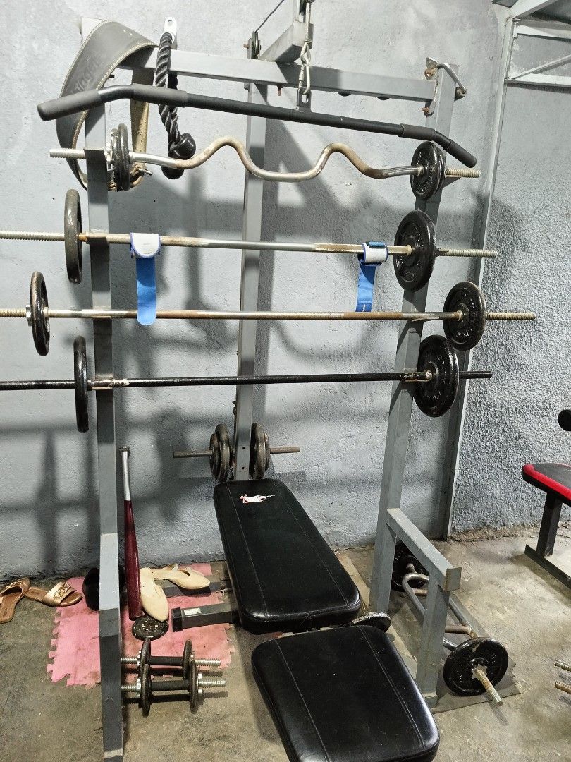 Gym equipment set (Category: Weights & Dumbbells) located in Las Pinas. Submitted by gooditems31 (Listing ID 1261149392, Image 2). Description: pull up cage can do squat Bench press shoulder tricep biceps chest back etc.. included 5feet long bar 6feet long bar super ez curl bar ez curl bar hammer bar 3pcs pair of dumbell preacher curl heavy duty 8pcs 5lbs plates 4pcs 10lbs plates 6pcs 15lbs plates 2pcs 20lbs plates 4pcs 2.5lbs plates Bench press 