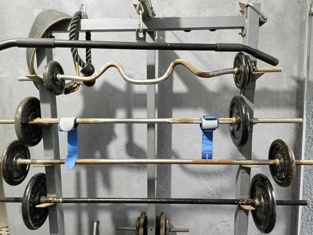 Gym equipment set (Category: Weights & Dumbbells) located in Las Pinas. Submitted by gooditems31 (Listing ID 1261149392, Image 3). Description: pull up cage can do squat Bench press shoulder tricep biceps chest back etc.. included 5feet long bar 6feet long bar super ez curl bar ez curl bar hammer bar 3pcs pair of dumbell preacher curl heavy duty 8pcs 5lbs plates 4pcs 10lbs plates 6pcs 15lbs plates 2pcs 20lbs plates 4pcs 2.5lbs plates Bench press 
