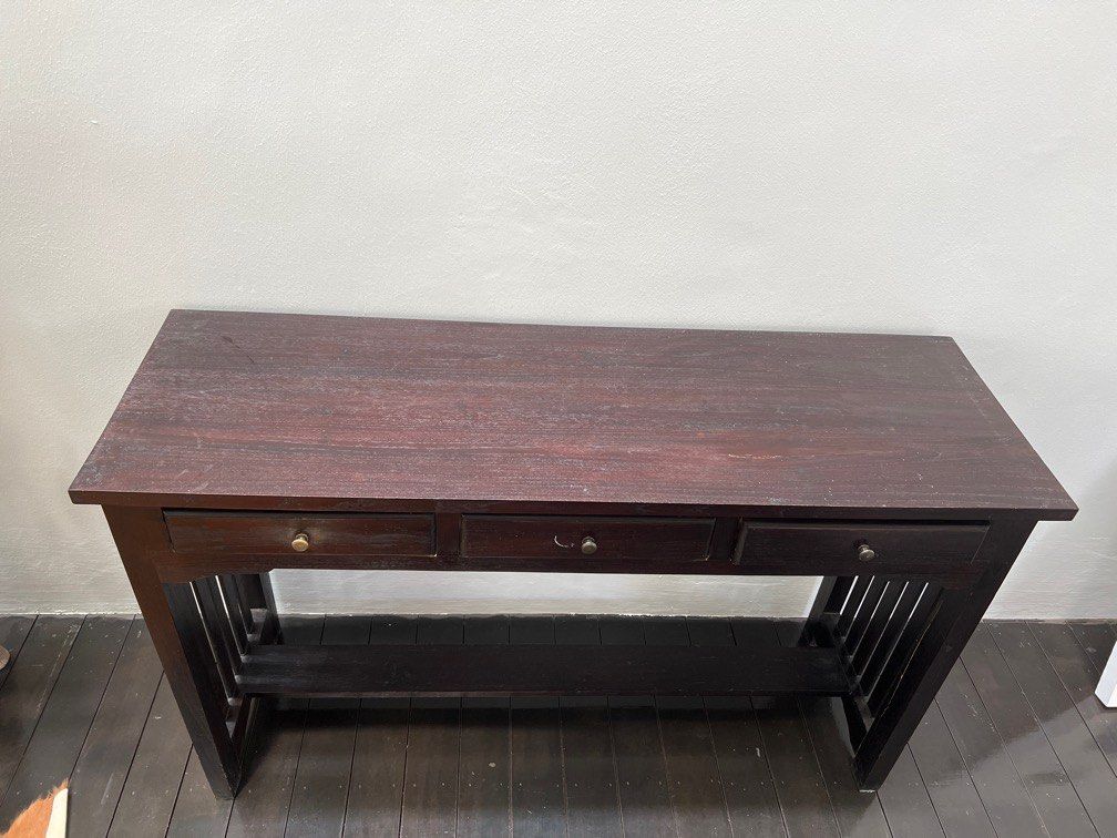 Console table (Category: Shelves, Cabinets & Racks) located in Singapore. Submitted by rblez (Listing ID 1261361536, Image 2). Description: Ca 120cm x 40cm, dark brown wood, first to pickup can have it.