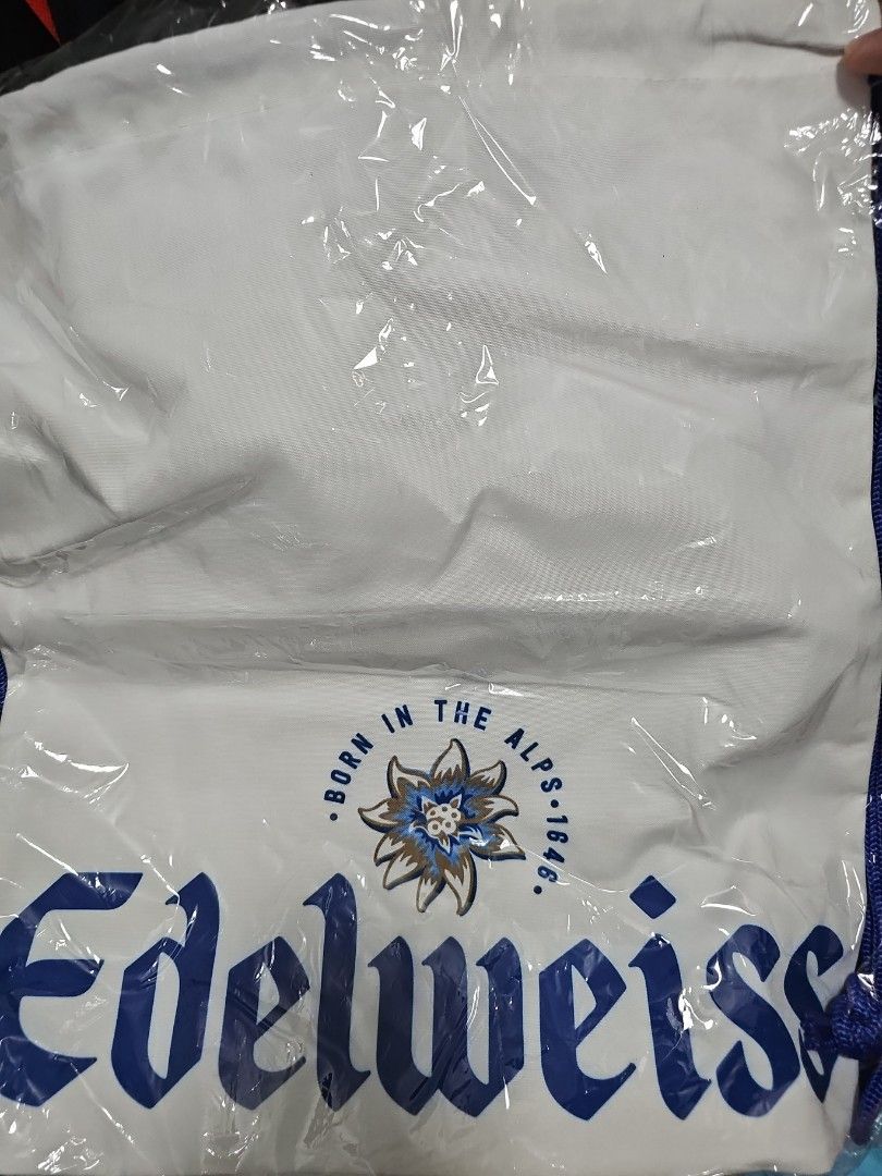 Drawstring bag (Category: Beach Bags) located in Singapore. Submitted by clearandclear123 (Listing ID 1261480914, Image 1). Description: edelweiss beer drawstring bag got 2 available. can fit 13inch laptop without a sweat. looking to clear.