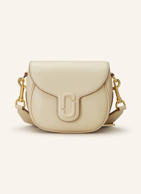 Marc Jacobs Saddle Bag (Category: Luxury Bags & Wallets) located in Quezon City. Submitted by love.marie.shoppe (Listing ID 1261329285, Image 2). Description: -Shoulder bag in leather -Adjustable and removable shoulder strap -Fabric magnetic flap closure with one internal pocket and zip logo Color: Cream.