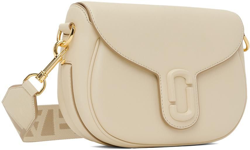 Marc Jacobs Saddle Bag (Category: Luxury Bags & Wallets) located in Quezon City. Submitted by love.marie.shoppe (Listing ID 1261329285, Image 1). Description: -Shoulder bag in leather -Adjustable and removable shoulder strap -Fabric magnetic flap closure with one internal pocket and zip logo Color: Cream.