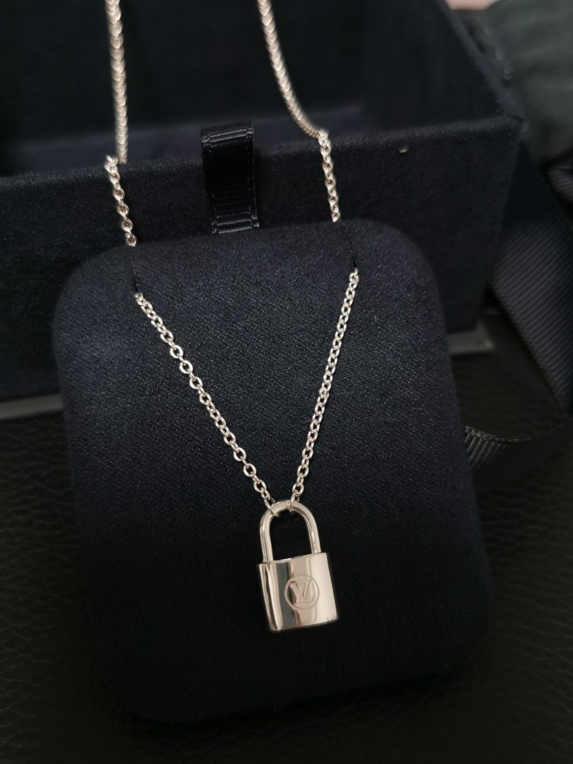 Sterling silver Louis Vuitton Unicef Lockit pendant necklace featuring a  rolo chain and lobster clasp closure. Date code…