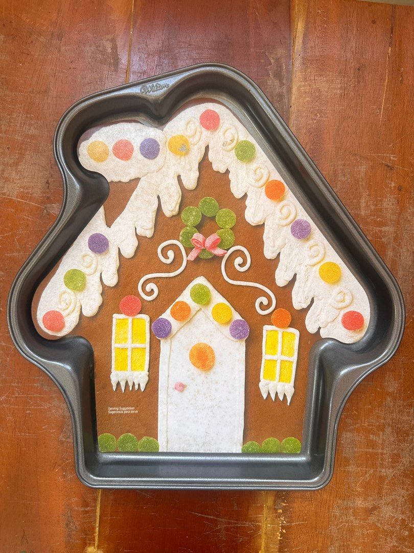 Wilton Gingerbread House Cookie Pan (Category: Bakeware) located in Muntinlupa City. Submitted by camotepie (Listing ID 1261406966, Image 1). Description: Wilton Gingerbread House Cookie Pan Hindi po ito nagamit. RFS: bawas gamit MOP: GCash Shipping: Lalamove or J&T only (shouldered by buyer) Location: Muntinlupa City.