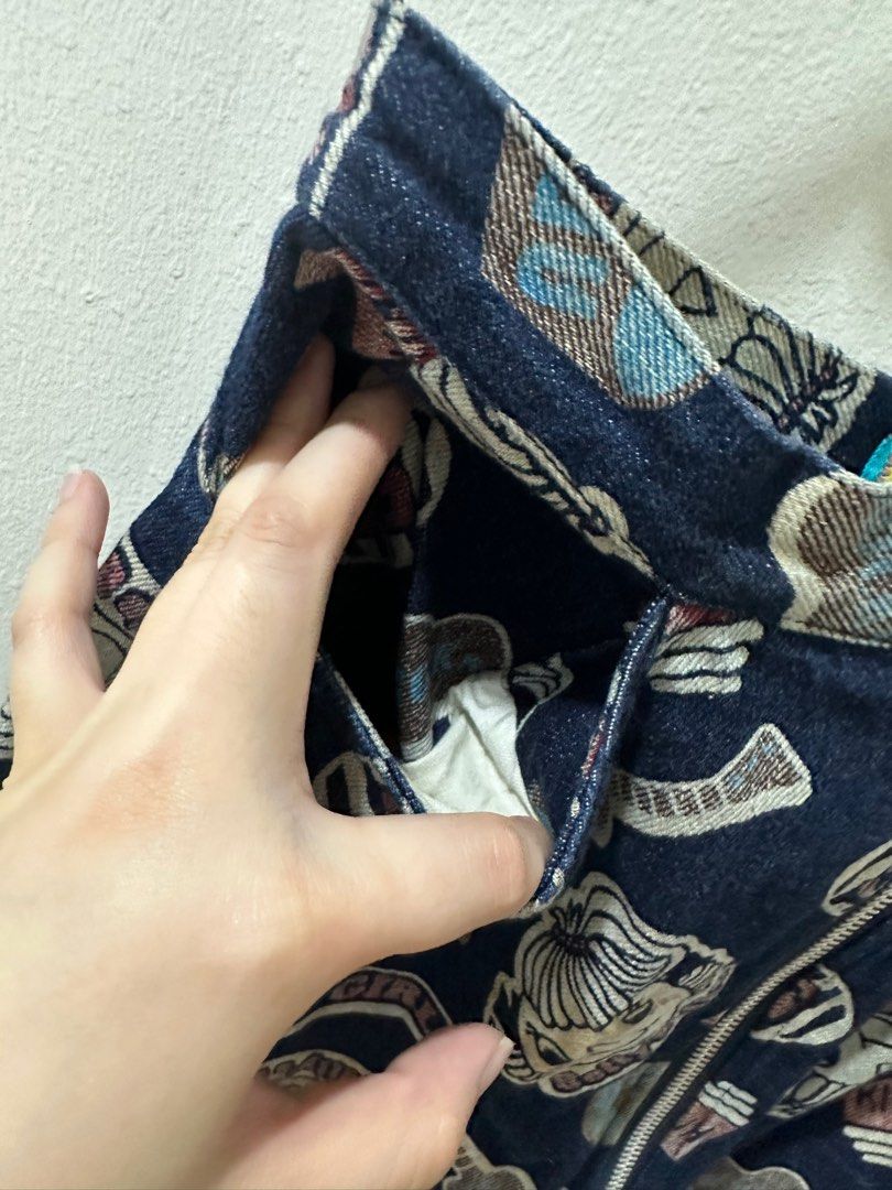 Y2K Graphic Denim Skirt (Category: Skirts) located in Marikina City. Submitted by retailr (Listing ID 1261434107, Image 2). Description: Adorable graphic denim skirt made for your Y2K style~ complete with pockets!! Size: XS-S Condition Well-used Some stain marks that come with used denim, but looks just like it’s part of the style (see photos) .