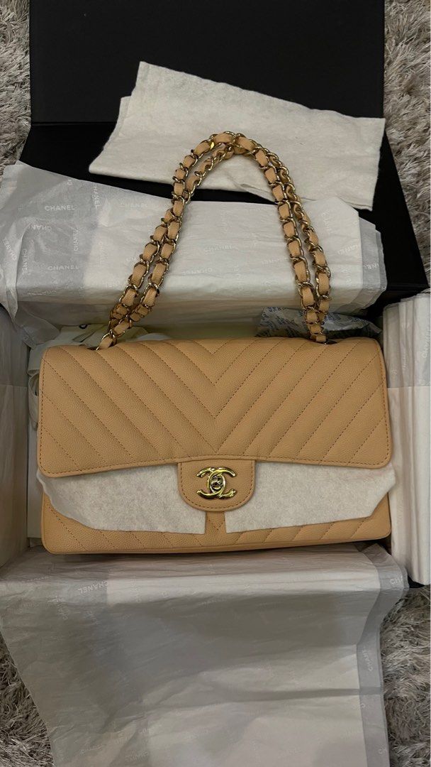 Chanel Medium Double Flap Chevron (Category: Luxury Bags & Wallets) located in Manila. Submitted by cjayberich28 (Listing ID 1261543943, Image 1). Description: Chanel Medium Double Flap Chevron Beige in caviar skin. Almost new! Rare piece. Used only twice and no issue. Complete inclusion. .
