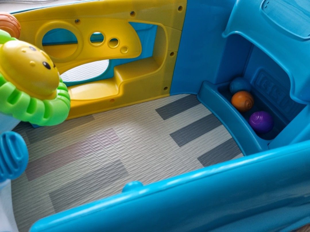 FisherPrice Laugh & Learn Crawl Around Car, stationary play center for