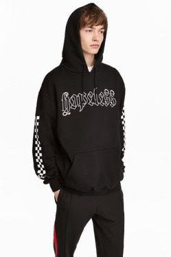 Hooded top on sale with a motif