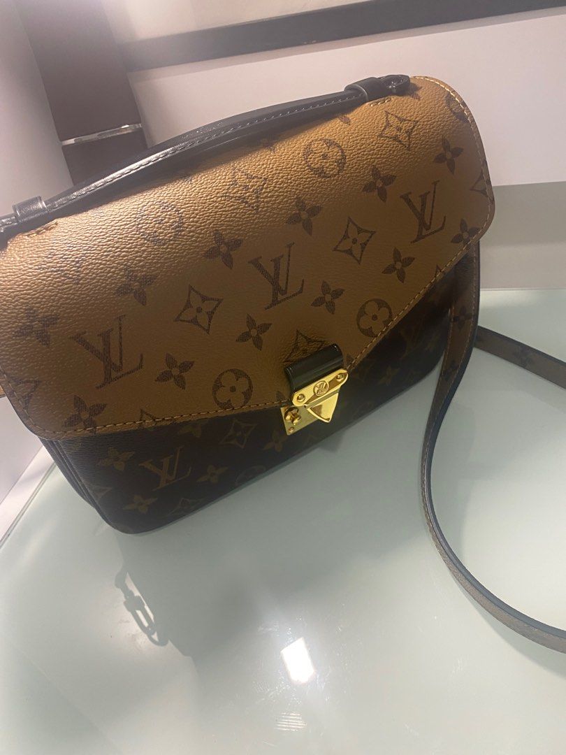 Reverse Monogram Pochette Trunk $2400 Base length: 4.50 in Height