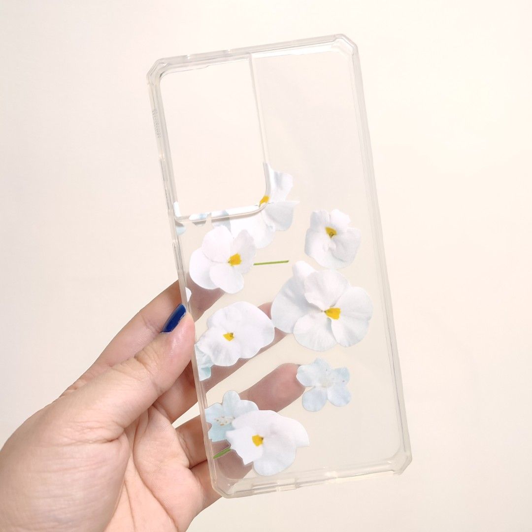 Samsung S21 Ultra Cases (Category: Cases & Sleeves) located in Taguig. Submitted by luxecharms (Listing ID 1261721198, Image 2). Description: Samsung S21 Ultra Cases Christian Dior case Floral case - with light fingerprint markings Glitter Case Paranaque based.