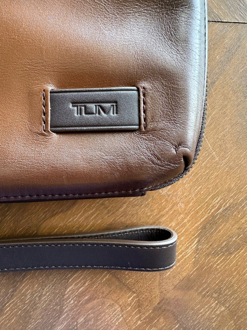 Tumi nassau sales triple zip clutch
